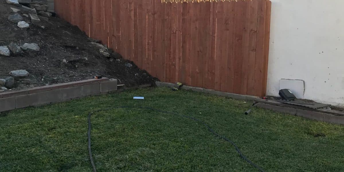New straight fence with even posts along the property line